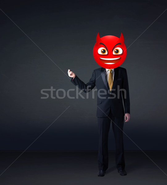 businessman wears devil smiley face Stock photo © ra2studio