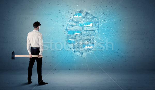 Business man hitting brick wall with huge hammer Stock photo © ra2studio