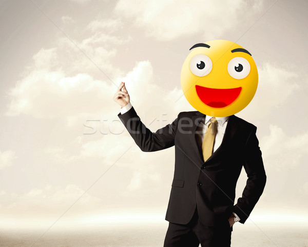 businessman wears yellow smiley face Stock photo © ra2studio