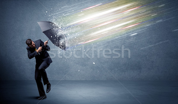 Uomo d'affari luce ombrello business acqua muro Foto d'archivio © ra2studio