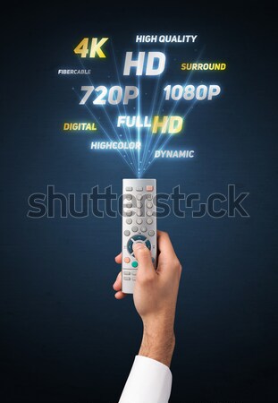 Hand Fernbedienung Multimedia halten heraus Technologie Stock foto © ra2studio