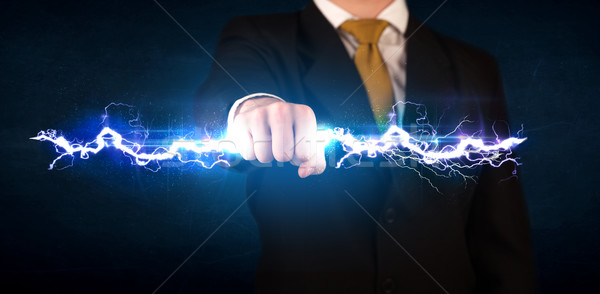 Geschäftsmann halten Strom Licht Bolzen Hände Stock foto © ra2studio