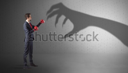 Geschäftsmann kämpfen scary Hand Schatten Stock foto © ra2studio