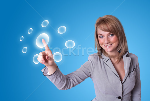 woman pressing digital buttons Stock photo © ra2studio