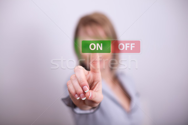 Woman pressing on off button Stock photo © ra2studio
