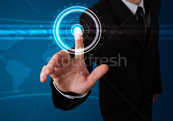 Businessman pressing high tech type of modern buttons  Stock photo © ra2studio