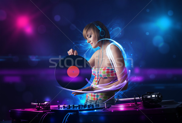 диск-жокей играет музыку световыми эффектами фары красивой Сток-фото © ra2studio