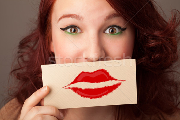 Heureux jolie femme carte baiser rouge à lèvres [[stock_photo]] © ra2studio