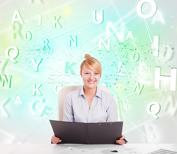 Business woman at desk with green word cloud Stock photo © ra2studio
