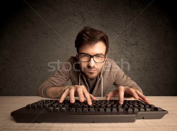 Computador datilografia teclado jovem Foto stock © ra2studio