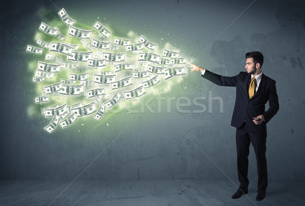 Business person throwing a lot of dollar bills concept Stock photo © ra2studio