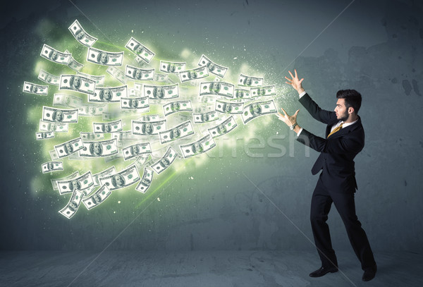 Business person throwing a lot of dollar bills concept Stock photo © ra2studio