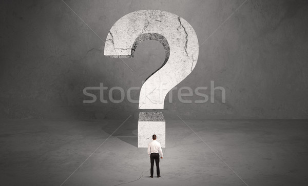 Confused businessman and big question mark Stock photo © ra2studio