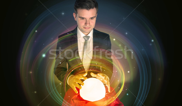 Hombre mirando futuro palabra magia pelota Foto stock © ra2studio
