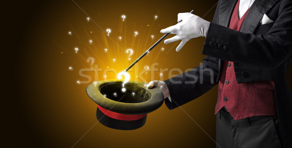 Magician conjure question signs from a cylinder Stock photo © ra2studio