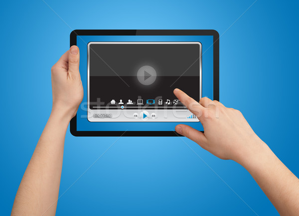 A male hand holding a touchpad media player  Stock photo © ra2studio