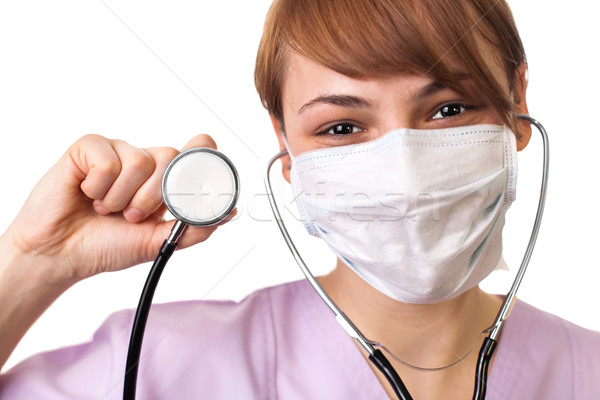 doctor holding stethoscope pointed toward camera Stock photo © ra2studio