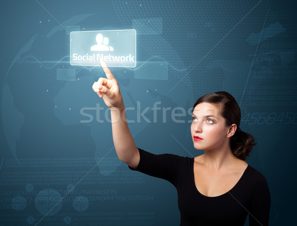 Businesswoman pressing modern social type of icons Stock photo © ra2studio