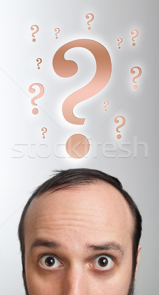 male adult has way too many questions in his head Stock photo © ra2studio