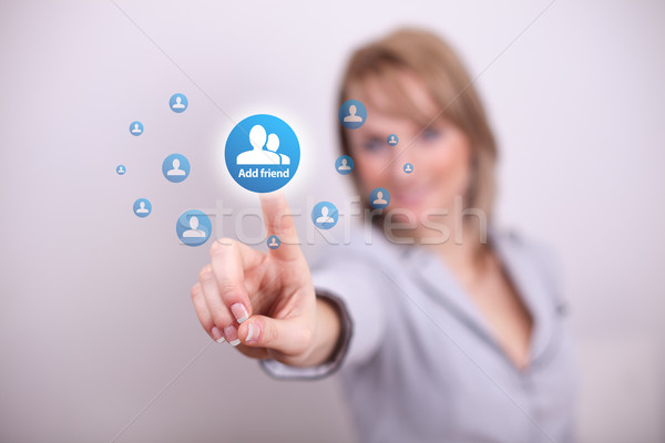 Woman pressing social add friend button  Stock photo © ra2studio