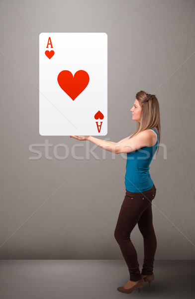 Beautifu woman holding a red heart ace Stock photo © ra2studio