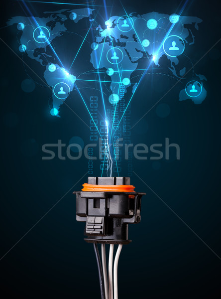 Social network icons coming out of electric cable Stock photo © ra2studio