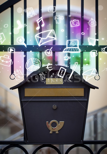 Colorful icons and symbols bursting out of a mailbox Stock photo © ra2studio