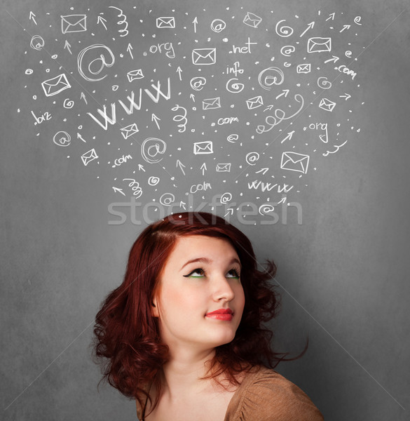 Young woman thinking with social network icons above her head Stock photo © ra2studio