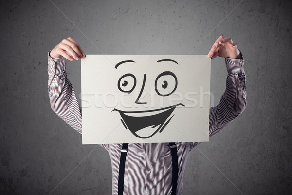 üzletember tart karton mosolygós arc elöl fiatal Stock fotó © ra2studio