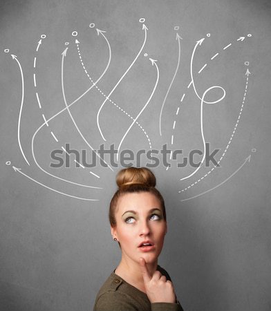 Stock photo: Young woman with arrows coming out of her head