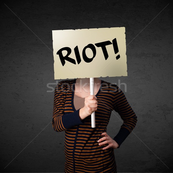 Young woman holding a protest sign Stock photo © ra2studio