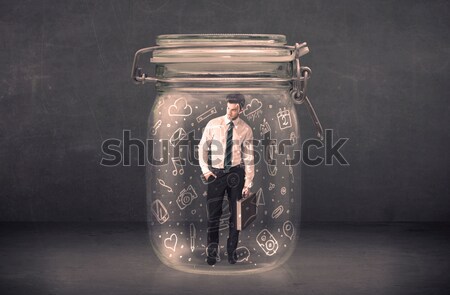 Business woman captured in glass jar with hand drawn media icons Stock photo © ra2studio
