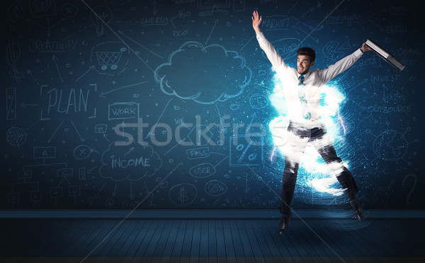 Happy business man jumping with storm cloud around him  Stock photo © ra2studio