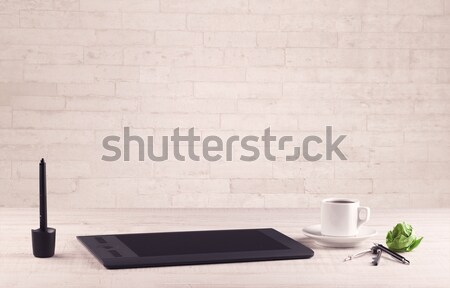 Office desk closeup with white brick wall Stock photo © ra2studio