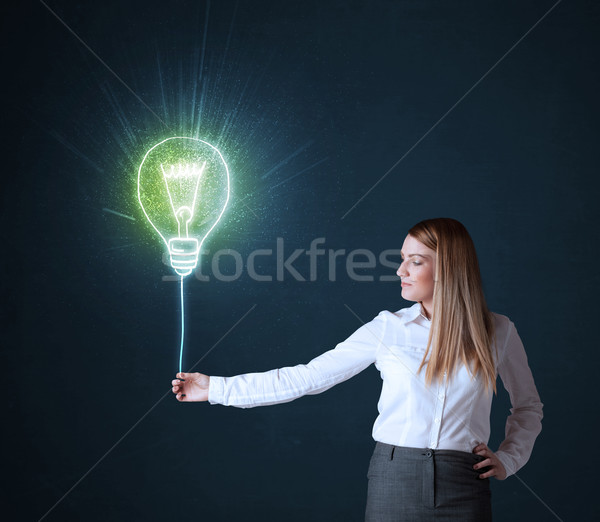 [[stock_photo]]: Femme · d'affaires · idée · ampoule · tenir · brillant · bleu