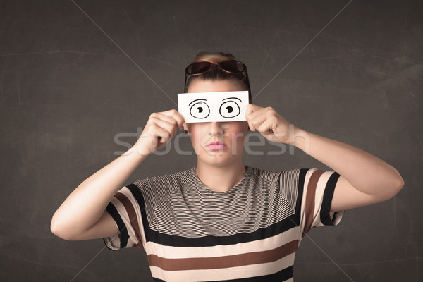 Funny woman looking with hand drawn paper eyes Stock photo © ra2studio