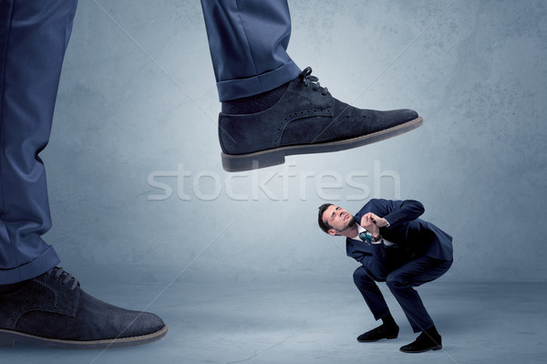 Trampled small businessman in suit Stock photo © ra2studio