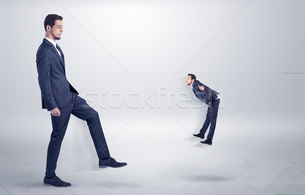 Small man fired by boss with white wallpaper Stock photo © ra2studio