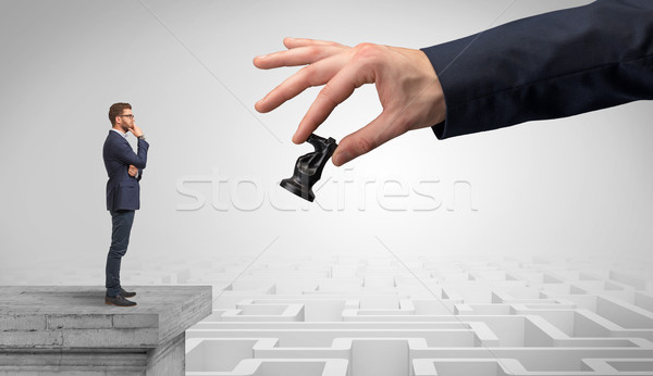 Little businessman from the top of the labyrinth thinking about strategies Stock photo © ra2studio