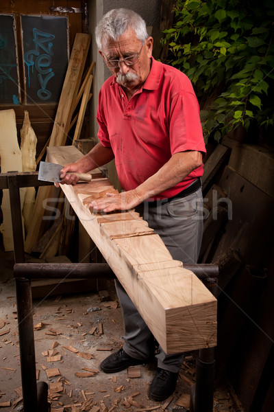 woodcarver working with mallet and chisel Stock photo © ra2studio