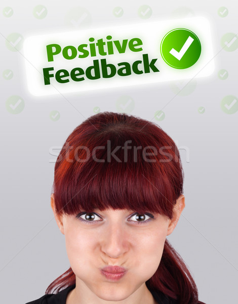 Young girl looking at positive negative signs Stock photo © ra2studio