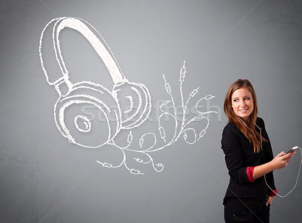 young woman singing and listening to music with abstract headphone Stock photo © ra2studio