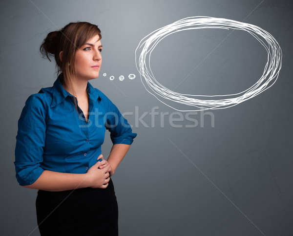 Beautiful young lady thinking about speech or thought bubble Stock photo © ra2studio
