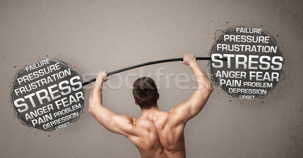Stock photo: muscular man fighting with stress