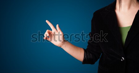 Woman pressing imaginary button Stock photo © ra2studio