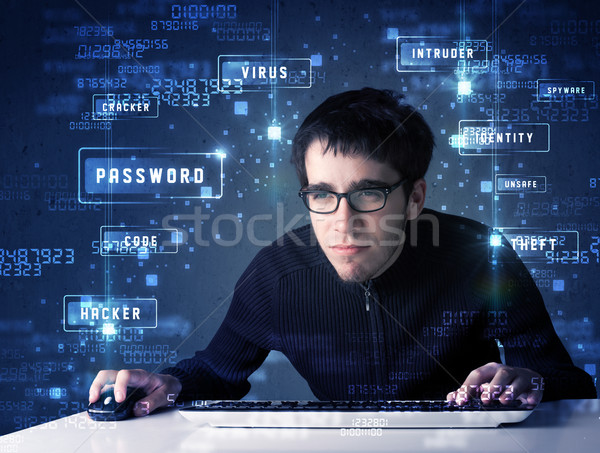 Hacker programing in technology enviroment with cyber icons  Stock photo © ra2studio