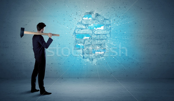 Business man hitting brick wall with huge hammer Stock photo © ra2studio