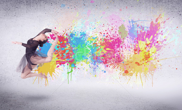 Modern street dancer jumping with colorful paint splashes Stock photo © ra2studio