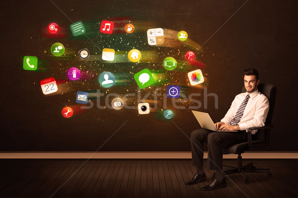 Uomo d'affari seduta sedia da ufficio laptop colorato app Foto d'archivio © ra2studio