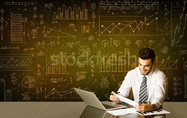 Businessman with diagram background Stock photo © ra2studio